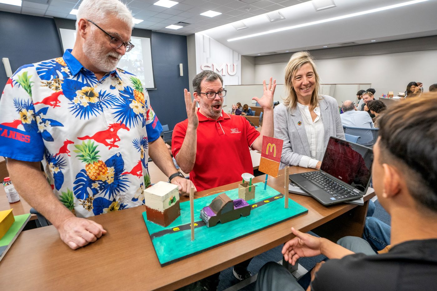 Professors interacting during special event