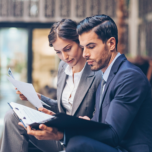 Woman and man working on project plan files