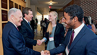 students shaking hands