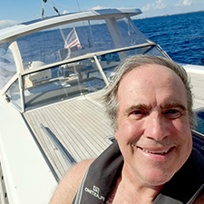Michael Petridis on a boat at sea
