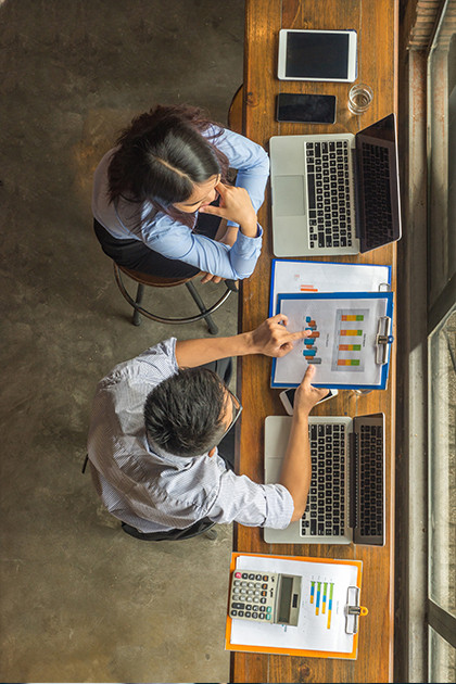 people at desk with computers