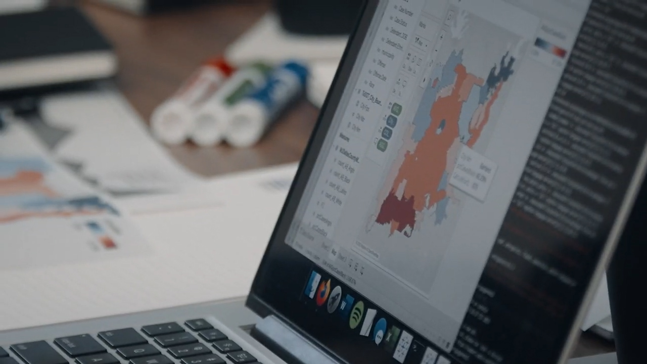A laptop showing a data map of cases in Texas.