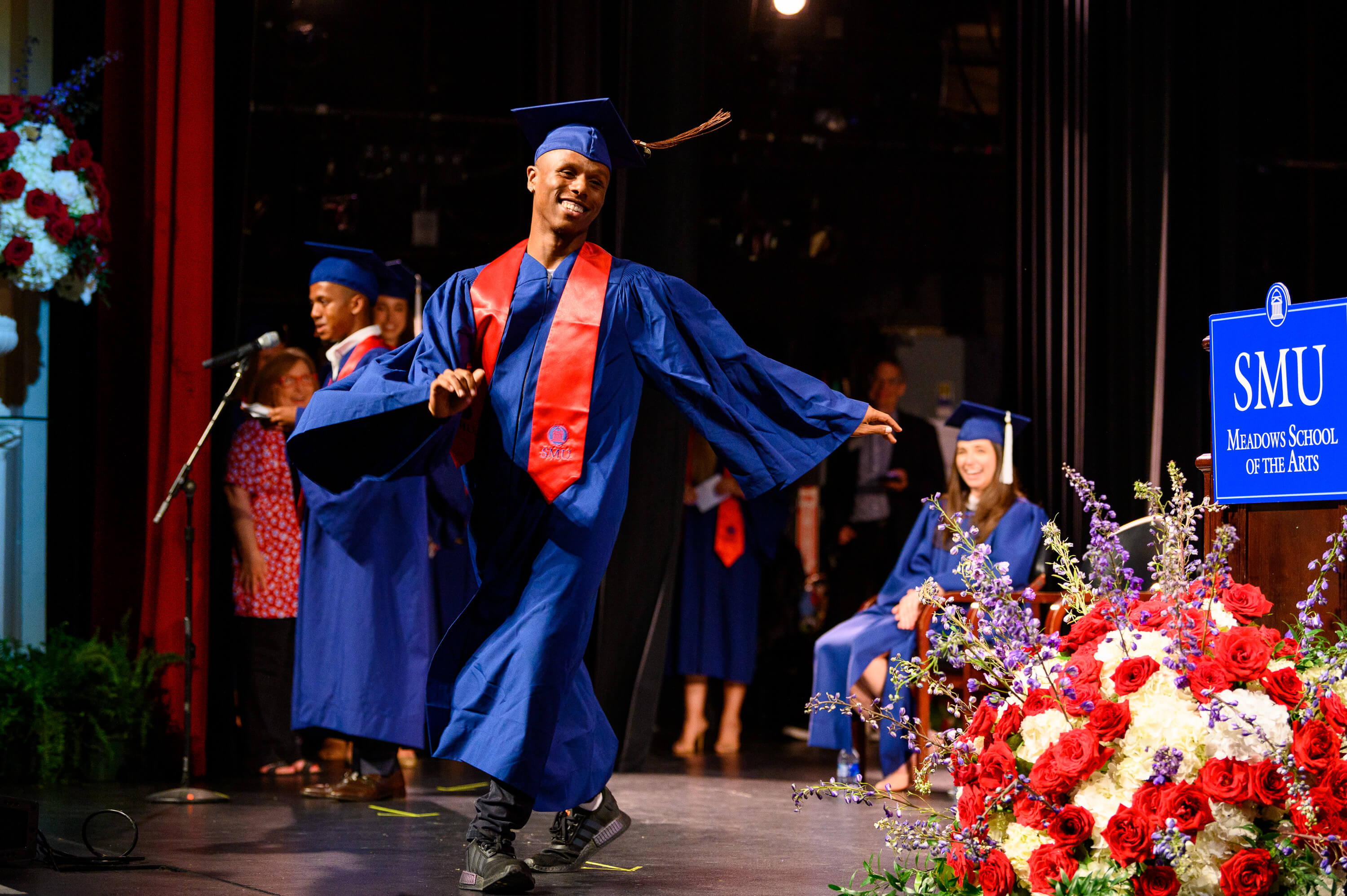 Graduation2022_StudentWalksAcrossStage