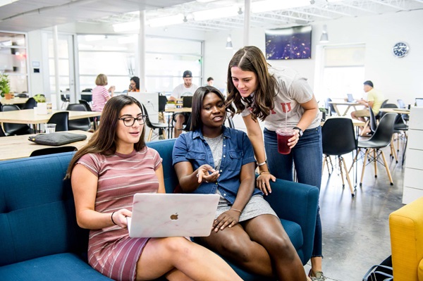 students looking at computer