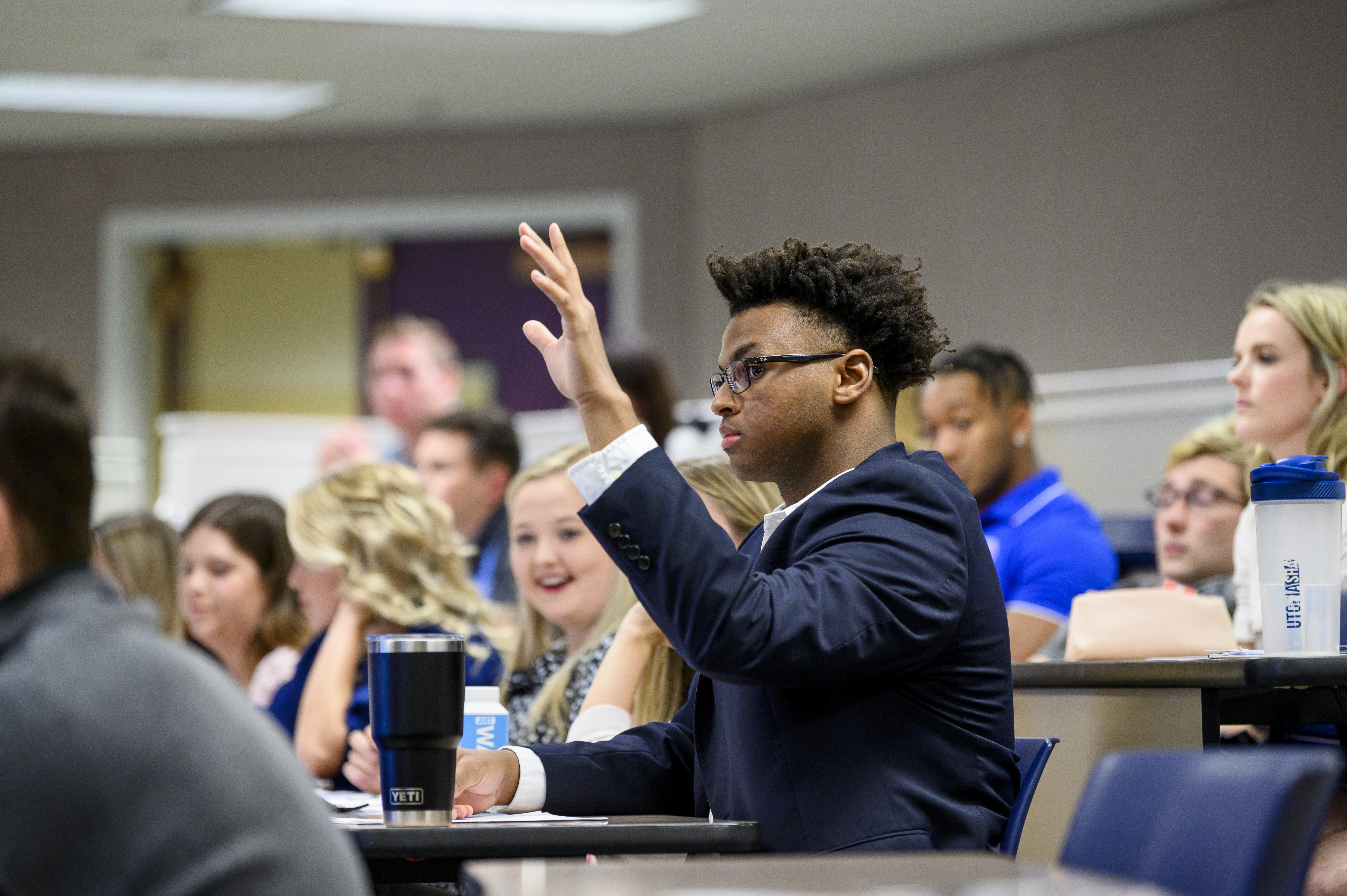 student raising hand
