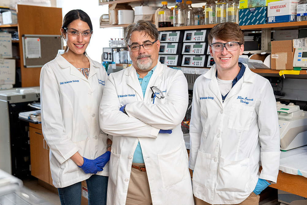 three people in lab coats