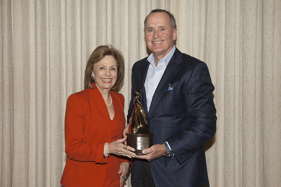 Dean Stephanie Knight presenting the Luminary Award to The Commit Partnership's North Texas Honoree