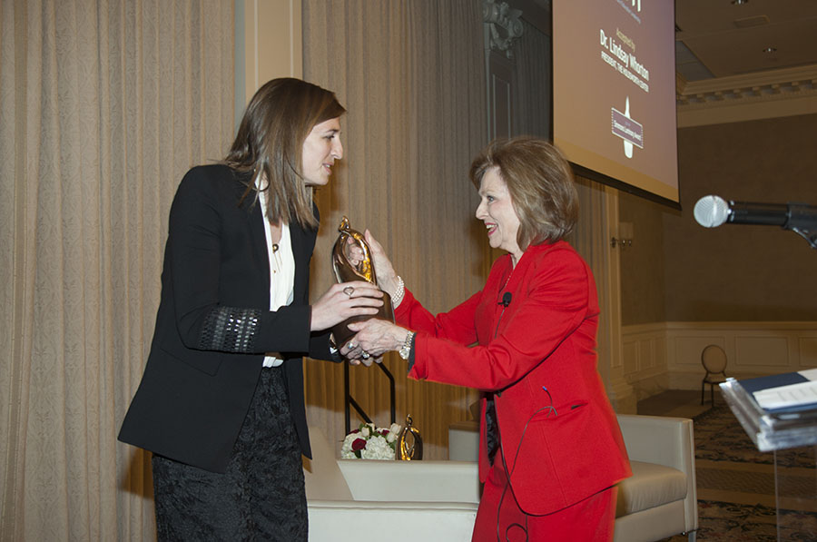 Dean Stephanie Knight presents the Luminary award to The Holdsworth Center, celebrating educational leadership in Texas.