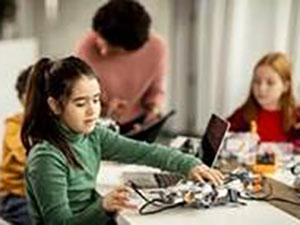 Middle schools students working with robotics